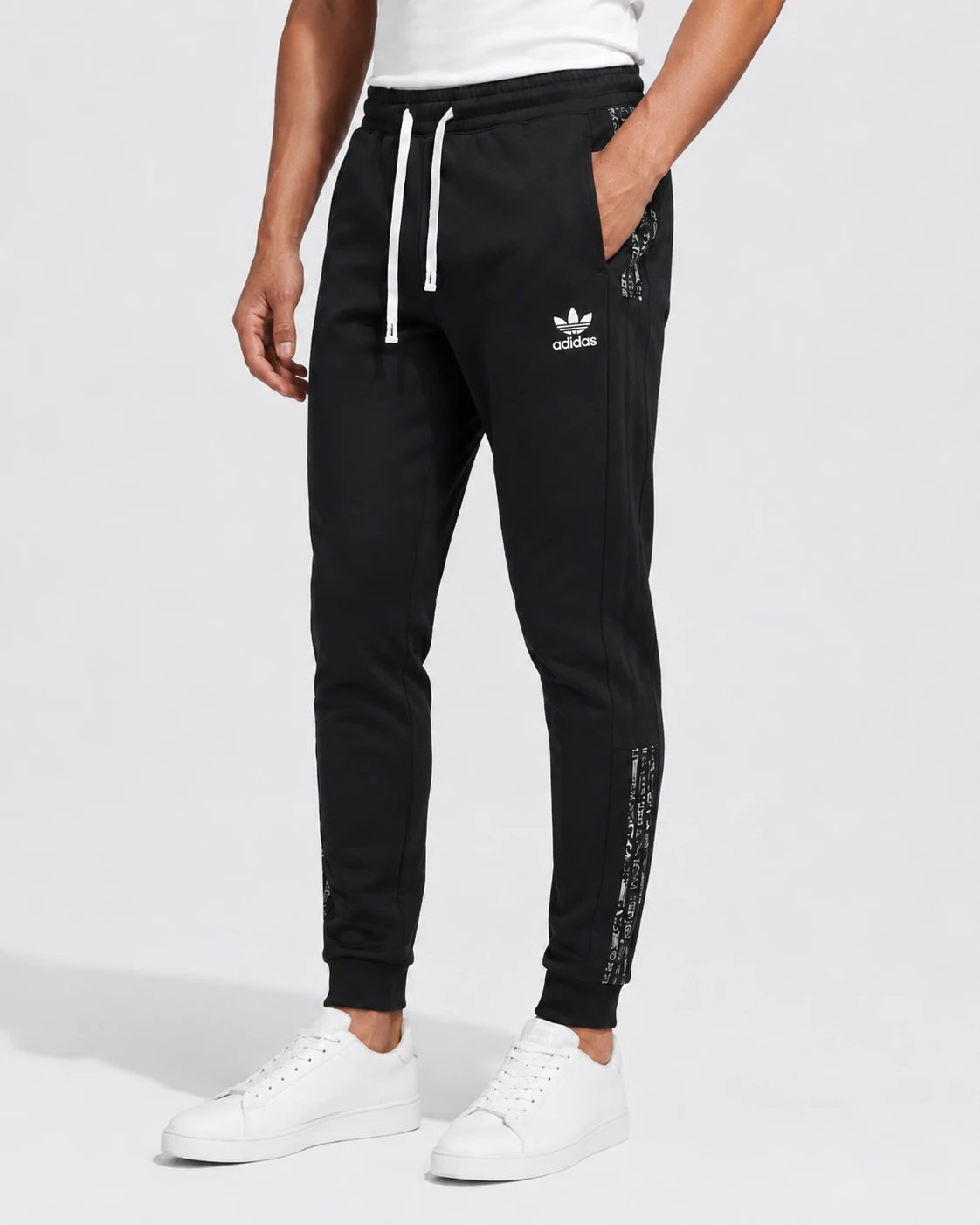 black-adidas-originals-taped-jogger-pants-model-front-angle-view-02 Sweat Pants 252773 with tapered legs and a modern casual athletic fit