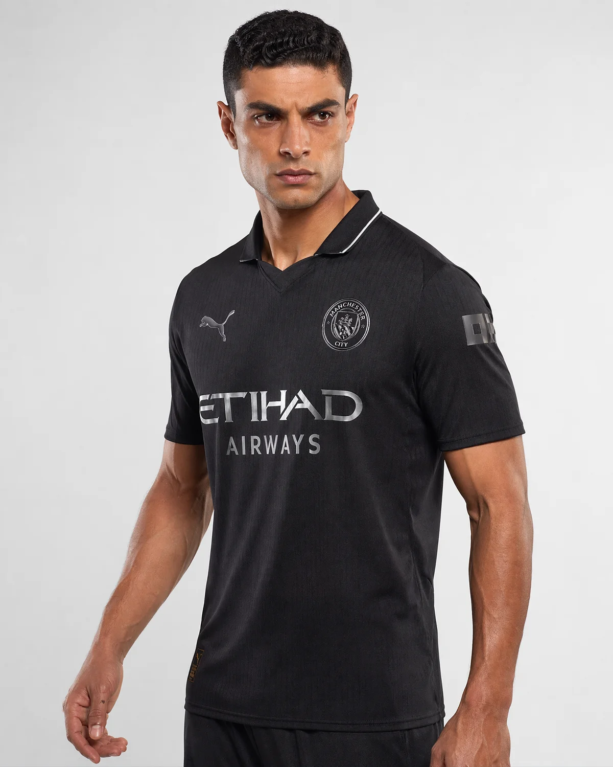 manchester-city-puma-black-away-kit-silver-badge-front-men Man City Fan Player 2025 - Image 1